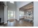 Bright foyer with hardwood floors and a dining room featuring an elegant chandelier and coffered ceiling at 137 River Birch Dr, Carrollton, GA 30116