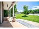 Relaxing covered porch with a manicured lawn view, adorned with flower pots and a 'Hello' welcome mat at 137 River Birch Dr, Carrollton, GA 30116