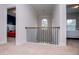 Hallway with chandelier and staircase views in the background at 137 River Birch Dr, Carrollton, GA 30116