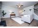 Cozy living room with a comfortable sofa, a ceiling fan, and hardwood floors at 137 River Birch Dr, Carrollton, GA 30116
