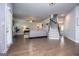 Open-concept living room flows into a dining area, showcasing hardwood floors and natural light at 137 River Birch Dr, Carrollton, GA 30116