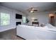 Inviting living room features a fireplace, ceiling fan, and hardwood floors at 137 River Birch Dr, Carrollton, GA 30116