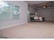 Large main bedroom with neutral colors, tray ceiling, and large window with a carpeted floor at 137 River Birch Dr, Carrollton, GA 30116