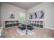 Spacious playroom with 2 sets of shelves, a table with 4 benches, and carpeted flooring at 137 River Birch Dr, Carrollton, GA 30116