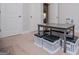 Neutral toned playroom with storage benches under playroom table and 2 doors at 137 River Birch Dr, Carrollton, GA 30116
