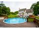 Large pool and deck in a beautiful backyard with a patio at 855 Hood Rd, Fayetteville, GA 30214
