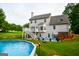 Home's backyard featuring a pool, a patio, and a deck at 855 Hood Rd, Fayetteville, GA 30214