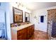 Upscale bathroom featuring a double vanity, tile flooring, a walk-in shower, and modern fixtures at 855 Hood Rd, Fayetteville, GA 30214