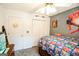 Bedroom with a ceiling fan, closet, and a playful superhero theme decor at 855 Hood Rd, Fayetteville, GA 30214