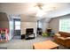 Spacious bonus room with gray walls, ceiling fan, carpeted floor, and plenty of natural light at 855 Hood Rd, Fayetteville, GA 30214