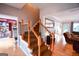 Elegant entryway with staircase, hardwood floors, and open view to living area at 855 Hood Rd, Fayetteville, GA 30214