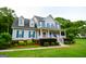 Beautiful two-story home featuring blue shutters and a charming front porch at 855 Hood Rd, Fayetteville, GA 30214