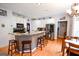 Modern kitchen with stainless steel appliances, granite countertops, and breakfast bar at 855 Hood Rd, Fayetteville, GA 30214