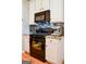 Modern kitchen featuring stainless steel appliances, granite counters, and decorative tile backsplash at 855 Hood Rd, Fayetteville, GA 30214