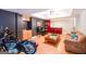 Inviting living area with bar, motorcycle, comfortable seating, and stylish decor at 855 Hood Rd, Fayetteville, GA 30214