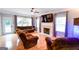 Bright living room with hardwood floors, fireplace, and access to outdoor deck at 855 Hood Rd, Fayetteville, GA 30214