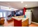 Open living space with snack bar, wood floors, ample seating, and modern appliances at 855 Hood Rd, Fayetteville, GA 30214