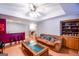 Comfortable and bright living room with wet bar, with built in shelving and hardwood floors at 855 Hood Rd, Fayetteville, GA 30214