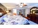 Spacious main bedroom features a king bed, an en-suite bathroom, and sophisticated dark wood furniture at 855 Hood Rd, Fayetteville, GA 30214
