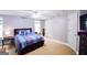 Bedroom with a patterned comforter, ceiling fan, closet, and gray walls at 855 Hood Rd, Fayetteville, GA 30214