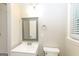 Updated bathroom featuring a modern vanity, stylish mirror, and tiled shower at 338 Mount Zion Rd, Hapeville, GA 30354