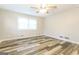 This bedroom offers updated flooring, ample natural light, and a ceiling fan at 338 Mount Zion Rd, Hapeville, GA 30354