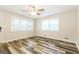 This bedroom offers updated flooring, ample natural light, and a ceiling fan at 338 Mount Zion Rd, Hapeville, GA 30354