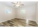 This bedroom offers updated flooring, ample natural light, and a ceiling fan at 338 Mount Zion Rd, Hapeville, GA 30354