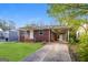Inviting brick home with a long driveway and a convenient carport at 338 Mount Zion Rd, Hapeville, GA 30354