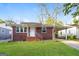 Charming brick home featuring a well-maintained lawn and covered parking at 338 Mount Zion Rd, Hapeville, GA 30354