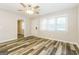 Bright living room featuring stylish flooring, a ceiling fan and natural light at 338 Mount Zion Rd, Hapeville, GA 30354
