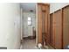 An unfinished bathroom, awaiting renovation, features exposed plumbing, window and doorway at 8005 Big Rock Dr, Douglasville, GA 30134