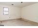 Bedroom under renovation showcasing a large window and bare walls at 8005 Big Rock Dr, Douglasville, GA 30134