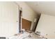 An unfinished bedroom has a new door leaning against the wall with construction materials at 8005 Big Rock Dr, Douglasville, GA 30134