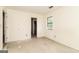 Bare bedroom with a window and view to a closet in a home renovation project at 8005 Big Rock Dr, Douglasville, GA 30134