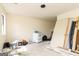 Spacious room under renovation, featuring a window and a white vintage stove at 8005 Big Rock Dr, Douglasville, GA 30134