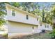 Rear exterior of home featuring a neutral color palette and mature trees, great for privacy at 2730 Pine Log Way, Buford, GA 30519