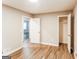 Inviting bedroom with wood-look flooring and white trim, offering ample closet space at 2730 Pine Log Way, Buford, GA 30519
