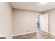 Cozy bedroom with wood-look flooring, neutral walls, and a bright window for natural light at 2730 Pine Log Way, Buford, GA 30519