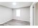 Minimalist bedroom with wood-look flooring and neutral walls, perfect for personalization at 2730 Pine Log Way, Buford, GA 30519