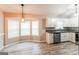 Bright kitchen/dining area with granite countertops, stainless steel appliances, and natural light at 2730 Pine Log Way, Buford, GA 30519