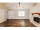 Spacious living room with fireplace, ceiling fan, laminate flooring and neutral paint at 2730 Pine Log Way, Buford, GA 30519