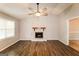 Living room featuring a fireplace with a wood mantel and elegant flooring at 2730 Pine Log Way, Buford, GA 30519