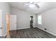 Main bedroom with vaulted ceiling, ceiling fan, laminate flooring, a view to bathroom at 2730 Pine Log Way, Buford, GA 30519