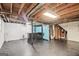 Unfinished basement offers exposed wood ceiling and painted walls and floor at 1749 Creat Se Trl, Smyrna, GA 30080