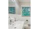 Bathroom featuring white tile, neutral walls, a pedestal sink and plenty of natural light at 1749 Creat Se Trl, Smyrna, GA 30080