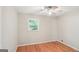 Empty bedroom with hardwood floors, natural light, ceiling fan and soft beige walls at 1749 Creat Se Trl, Smyrna, GA 30080