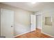 Bright bedroom with hardwood floors, two closets and neutral paint at 1749 Creat Se Trl, Smyrna, GA 30080