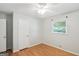 Cozy bedroom featuring hardwood floors, a ceiling fan, and natural light from the window at 1749 Creat Se Trl, Smyrna, GA 30080