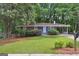 Lovely brick home with well-manicured lawn, mature trees, and an inviting front entrance at 1749 Creat Se Trl, Smyrna, GA 30080